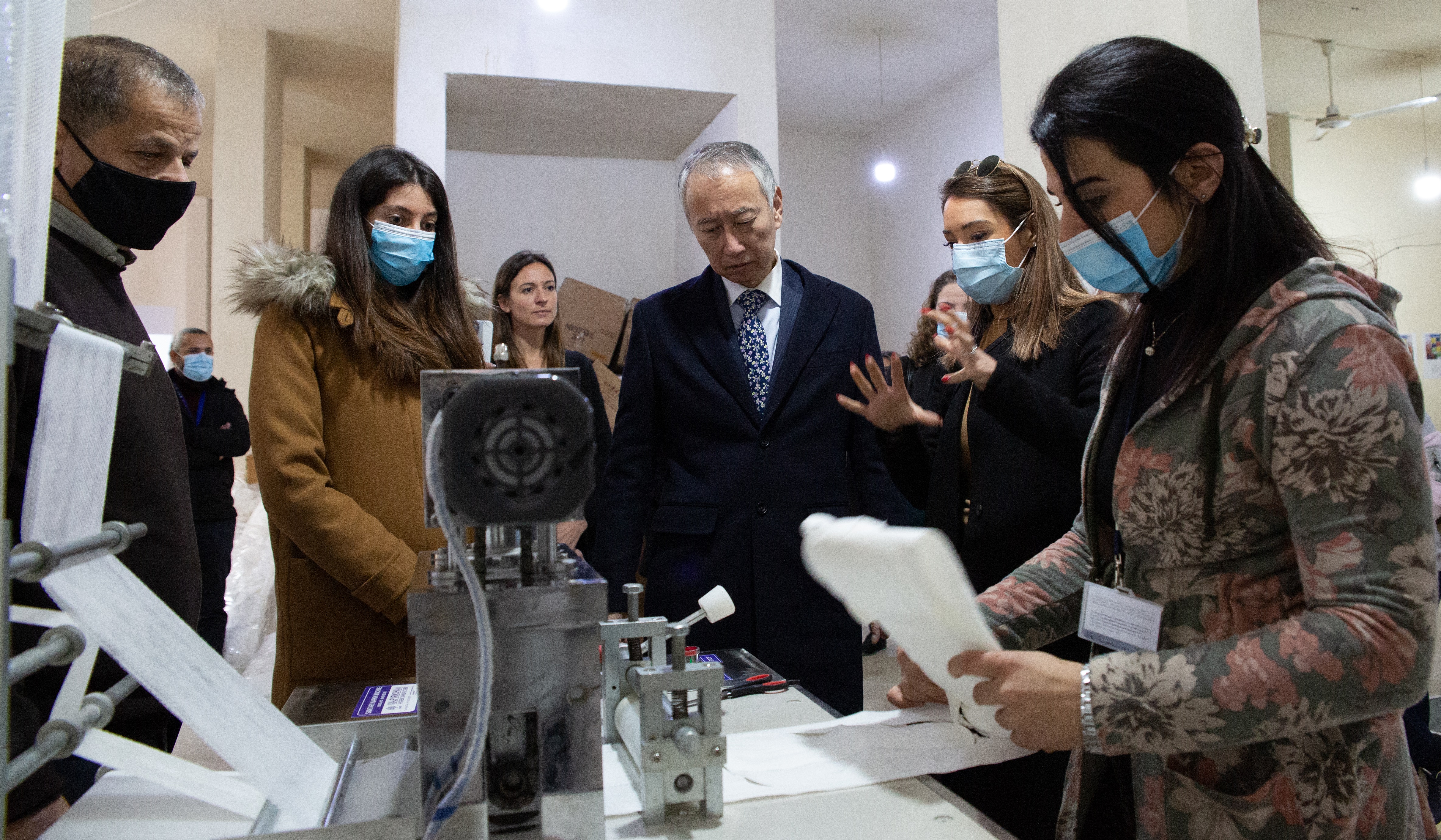 The Ambassador of Japan to Lebanon, H.E. OKUBO Takeshi, toured the sanitary production unit established by the social enterprise Roof and Roots, in Jabal Mohsen, Tripoli. Photo: UN Women/ Lauren Rooney