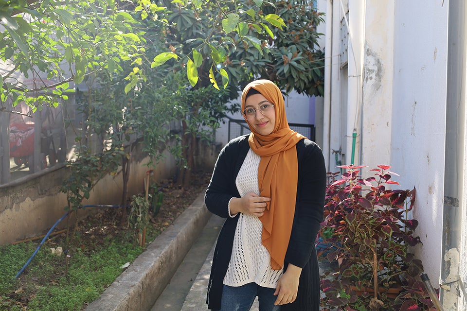 Safa, 25, a community worker at Initiate and Women Program Association’s community kitchen in Ein El Helweh camp, Saida, Lebanon. Photo: Anas Chehab/Initiate.