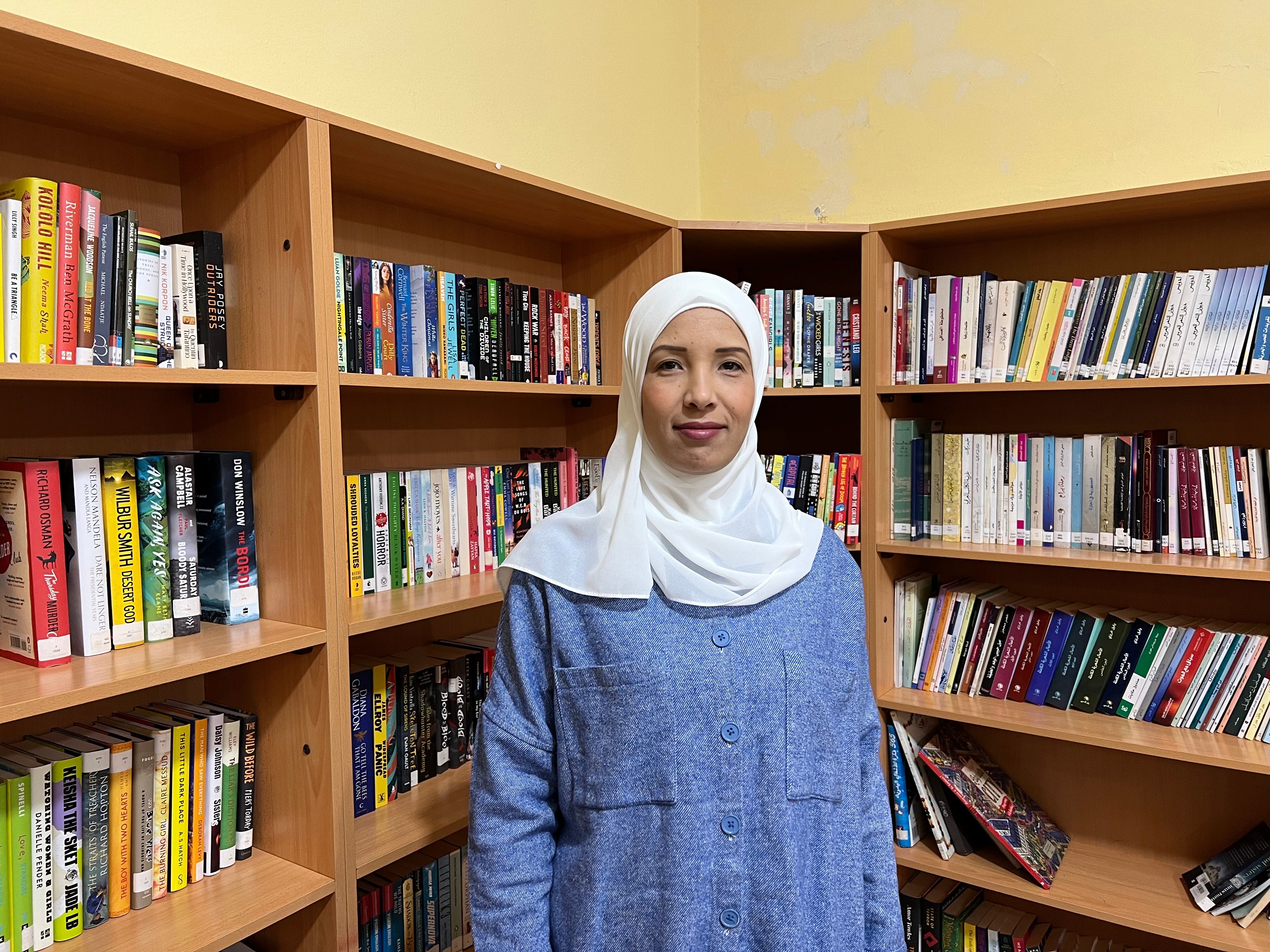 Rasha Abou Kharoub in a library